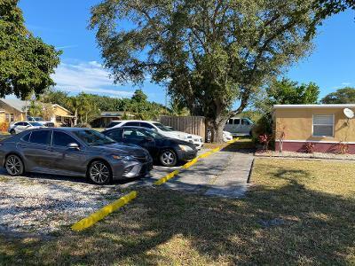 5856 Garfield Street, Unit 2 Hollywood, FL 33021 - Photo 6 of 11 a view of a yard with cars parked