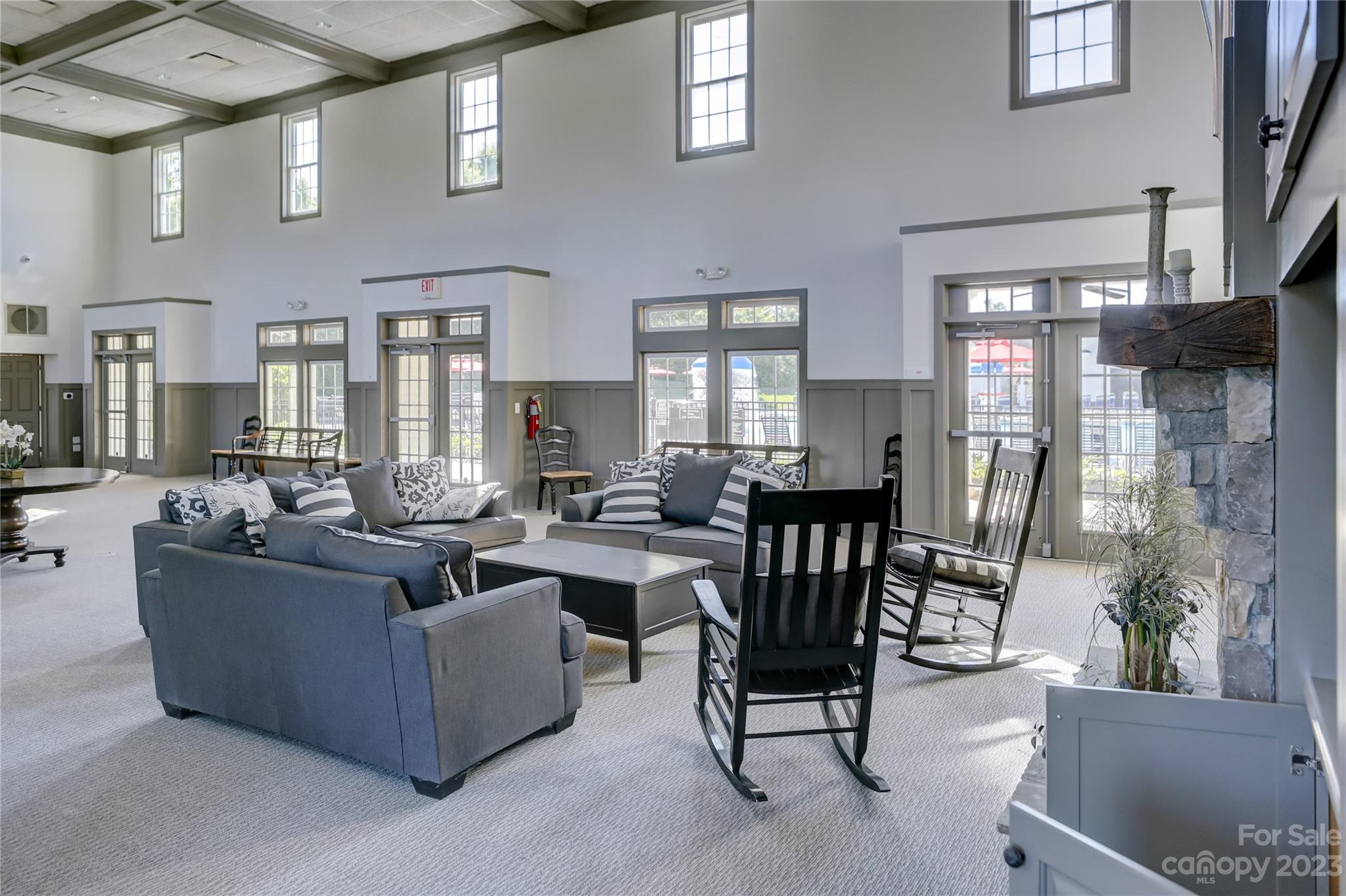 7108 Michael Scott Crossing Fort Mill, SC 29708 - Photo 8 of 24 a living room with fireplace furniture and a large window