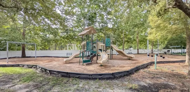 a view of a chair and tables in the patio