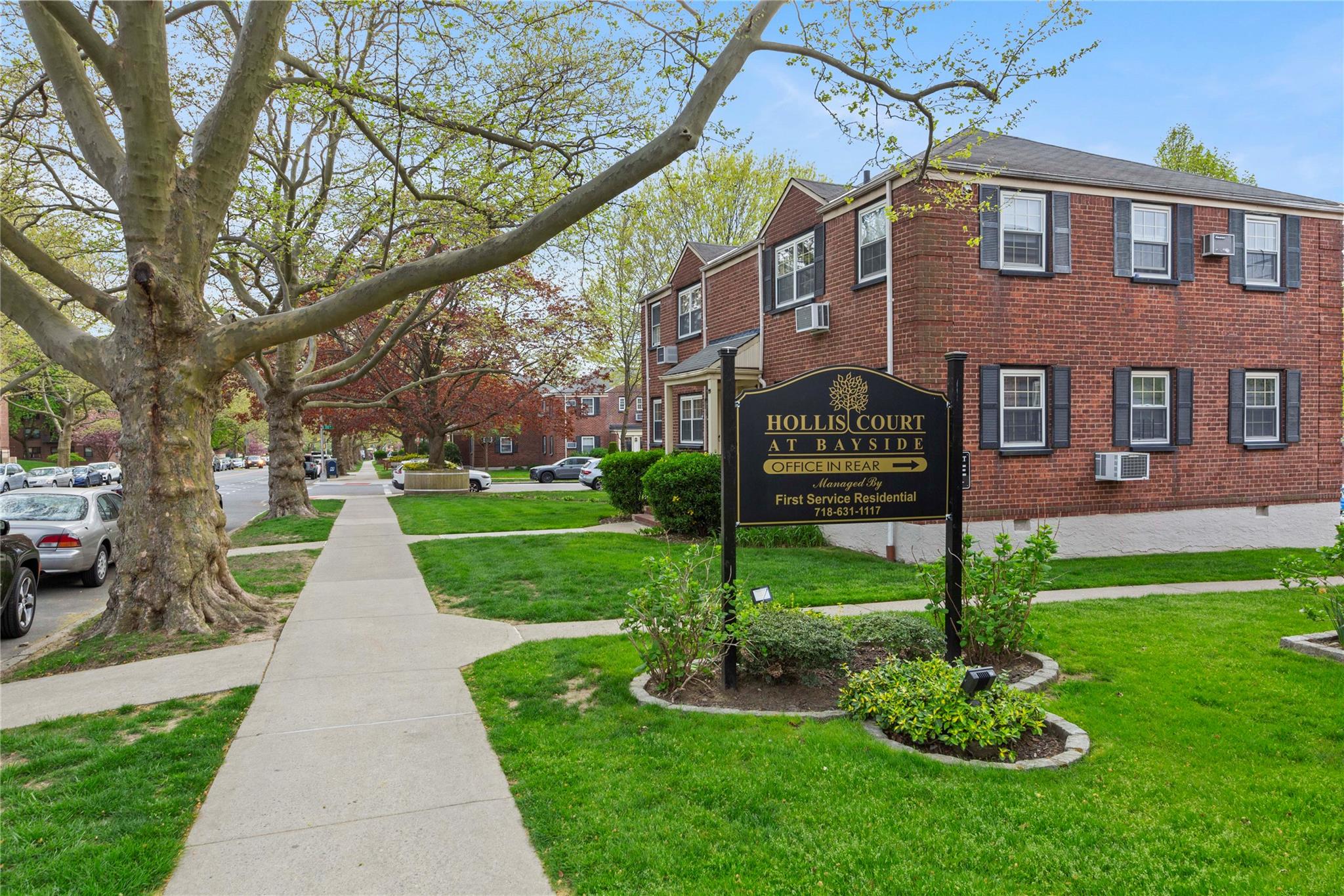 a front view of a building with garden