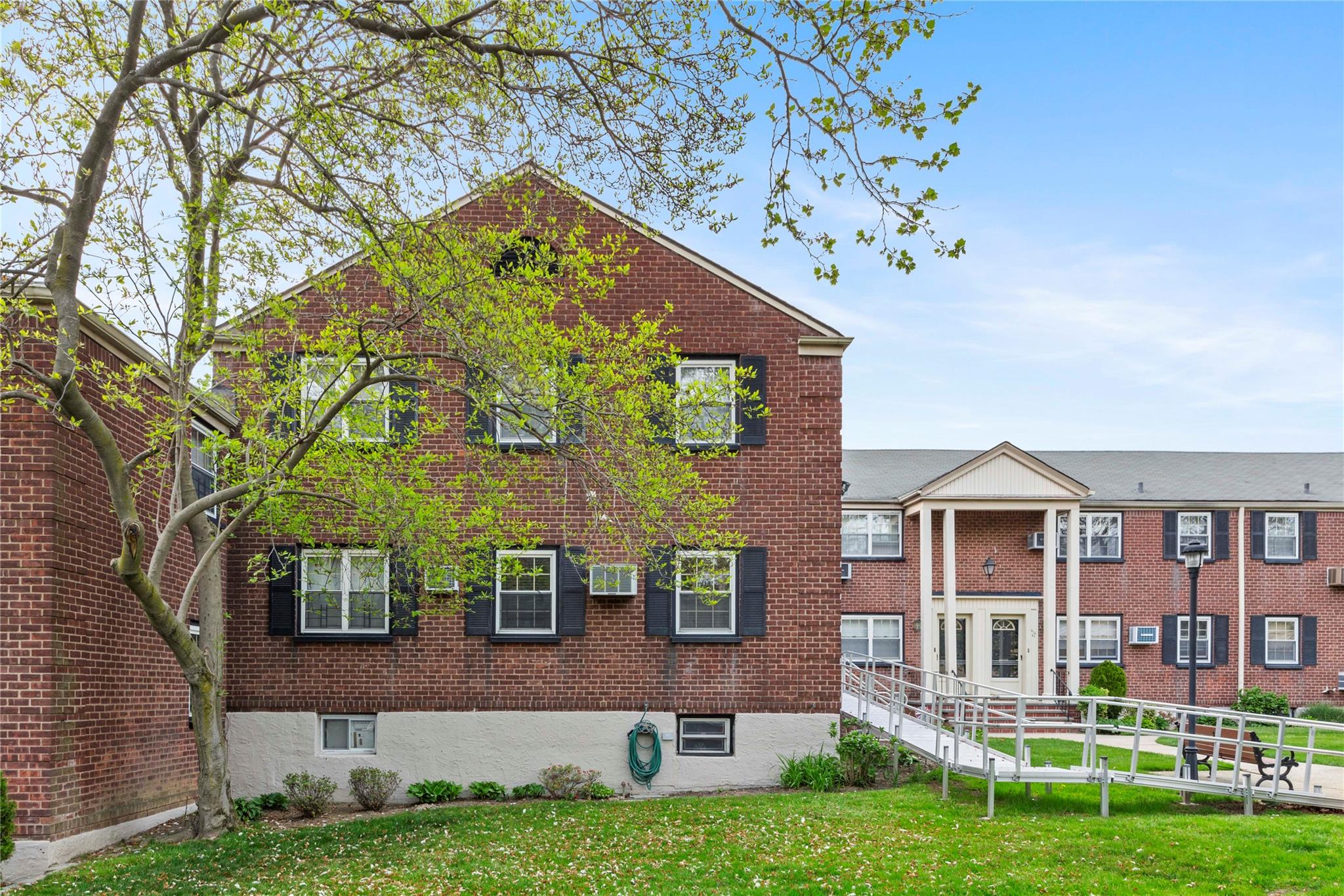 213-15 73rd Avenue, Unit LOWR Queens, NY 11364 - Photo 11 of 13 front view of house with a yard