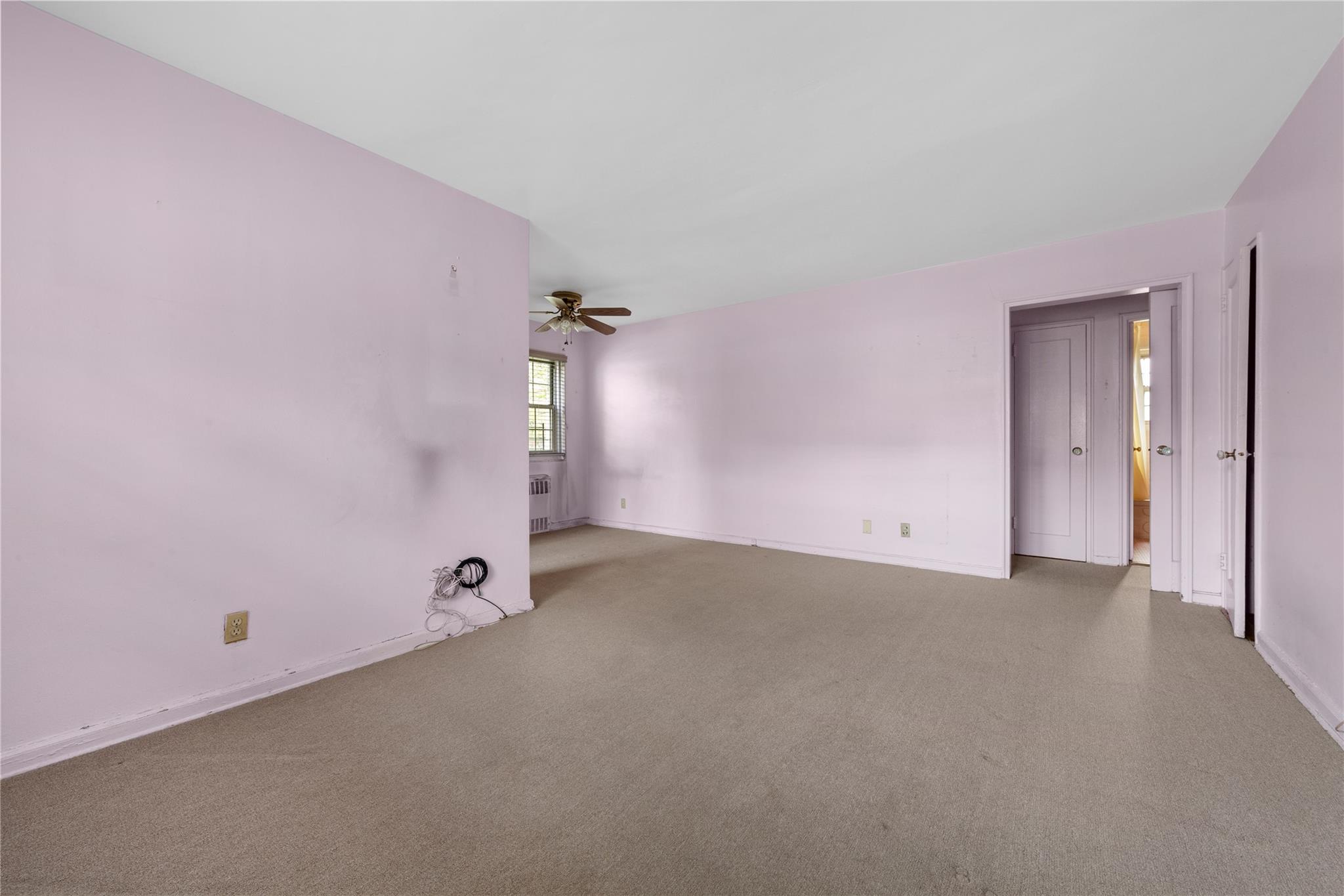 213-15 73rd Avenue, Unit LOWR Queens, NY 11364 - Photo 4 of 13 an empty room with an entryway