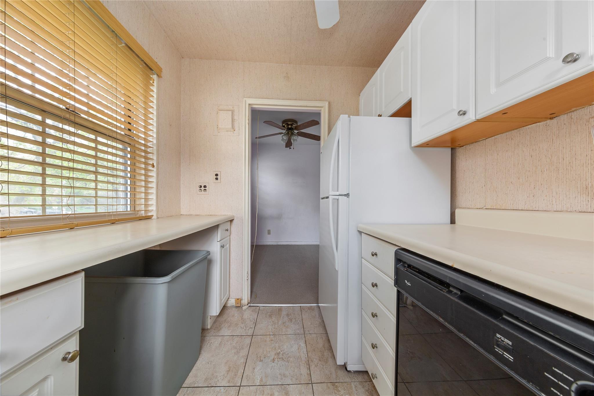 213-15 73rd Avenue, Unit LOWR Queens, NY 11364 - Photo 8 of 13 a kitchen with a sink and refrigerator