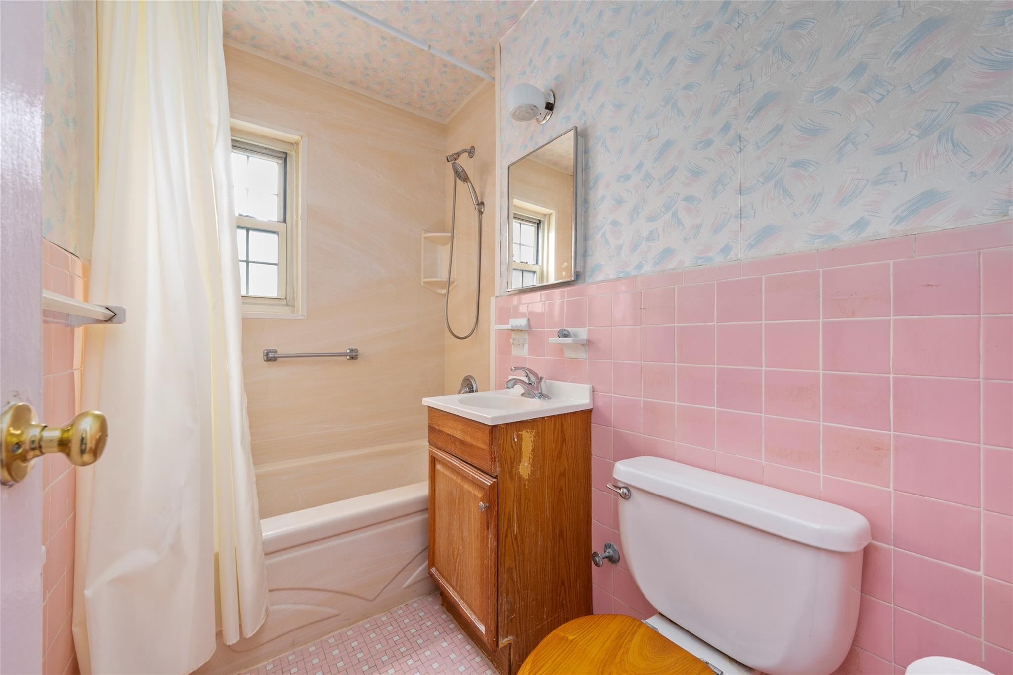 213-15 73rd Avenue, Unit LOWR Queens, NY 11364 - Photo 9 of 13 a bathroom with a sink toilet and shower