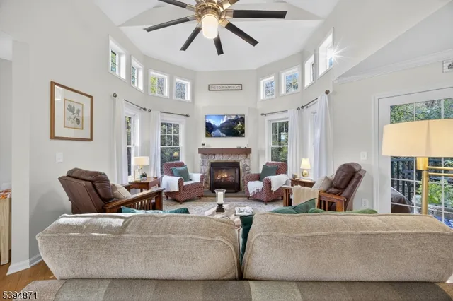 a view of a dining room with furniture and chandelier