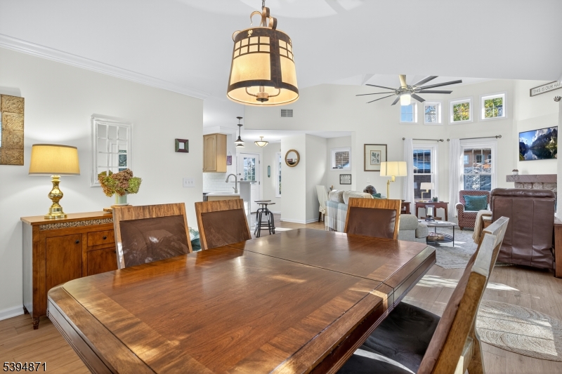 10-11 Pine Crescent, Unit 21 Vernon, NJ 07462 - Photo 15 of 50 a living room with dining table