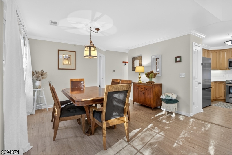 10-11 Pine Crescent, Unit 21 Vernon, NJ 07462 - Photo 16 of 50 a view of a dining room with furniture