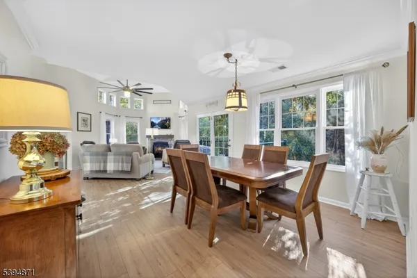 a view of a dining room with furniture window and outside view