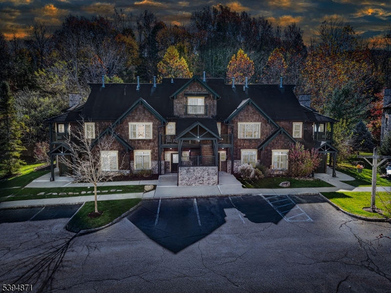 10-11 Pine Crescent, Unit 21 Vernon, NJ 07462 - Photo 3 of 50 a front view of a house with garden