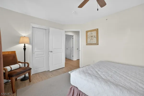 a bedroom with a bed and a chair
