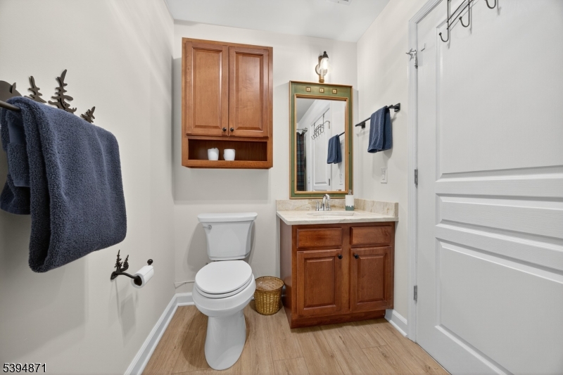 10-11 Pine Crescent, Unit 21 Vernon, NJ 07462 - Photo 37 of 50 a bathroom with a toilet sink and shower