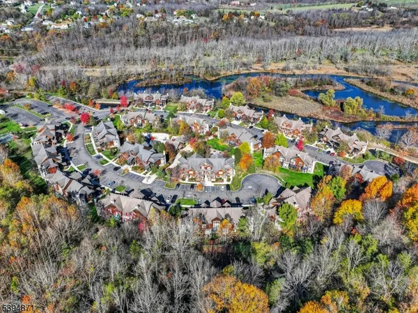 an aerial view of a houses with yard