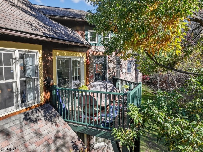 10-11 Pine Crescent, Unit 21 Vernon, NJ 07462 - Photo 7 of 50 a view of a patio with iron fence