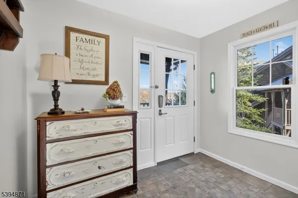 a view of room with window and cabinet
