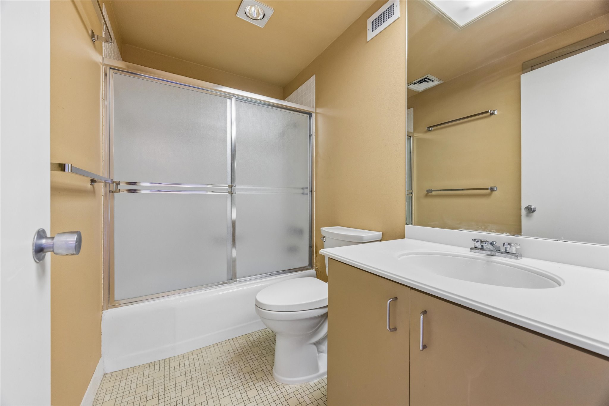 1801 Lavaca Street, Unit 14K Austin, TX 78701 - Photo 12 of 30 a bathroom with a sink a toilet and shower