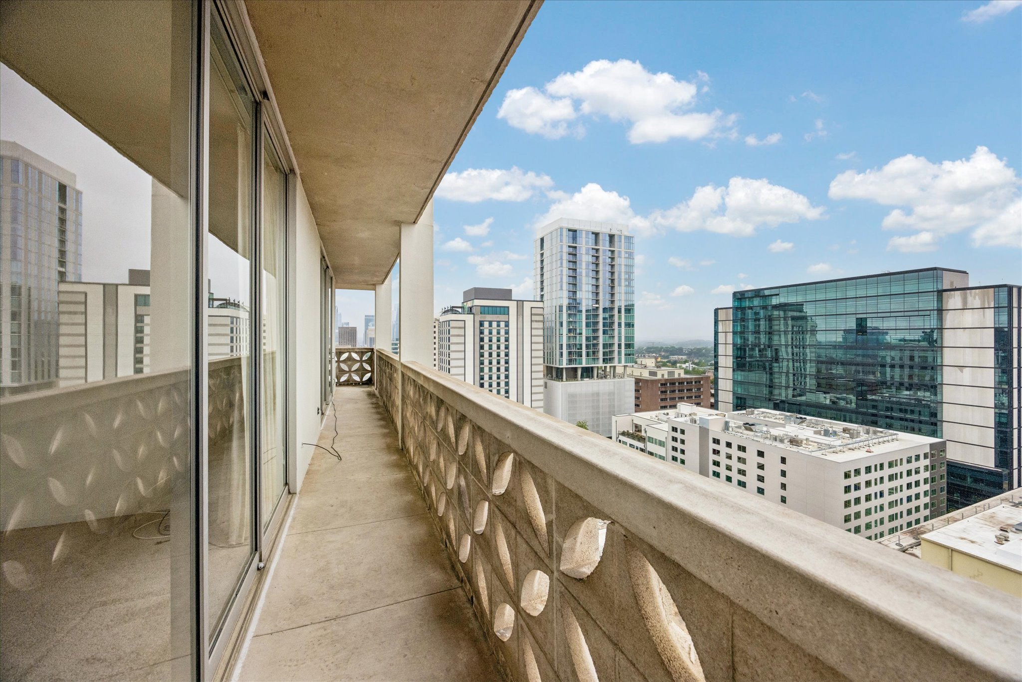 1801 Lavaca Street, Unit 14K Austin, TX 78701 - Photo 13 of 30 a view of balcony with couch