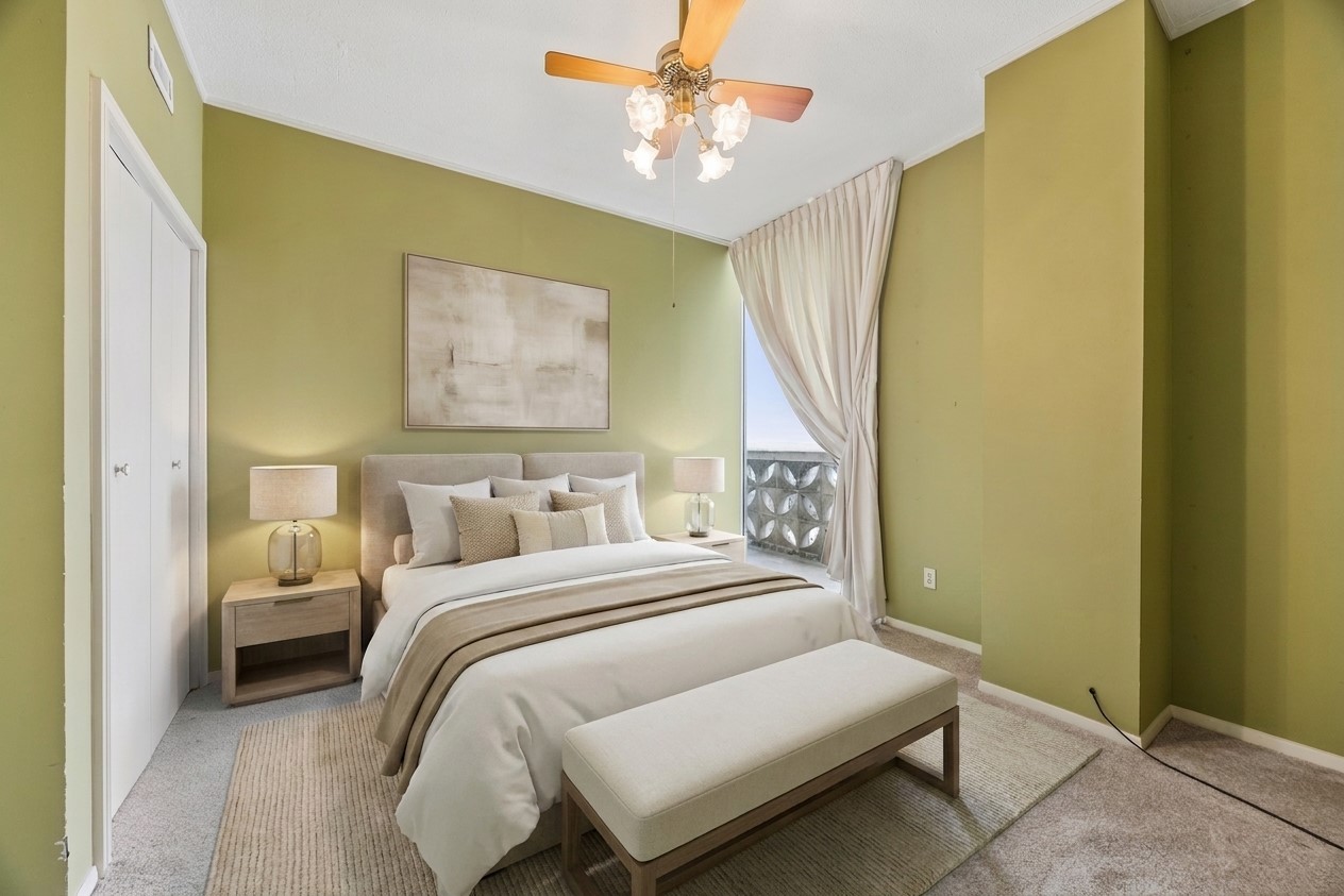 1801 Lavaca Street, Unit 14K Austin, TX 78701 - Photo 5 of 30 a bedroom with a bed and a painting on the wall