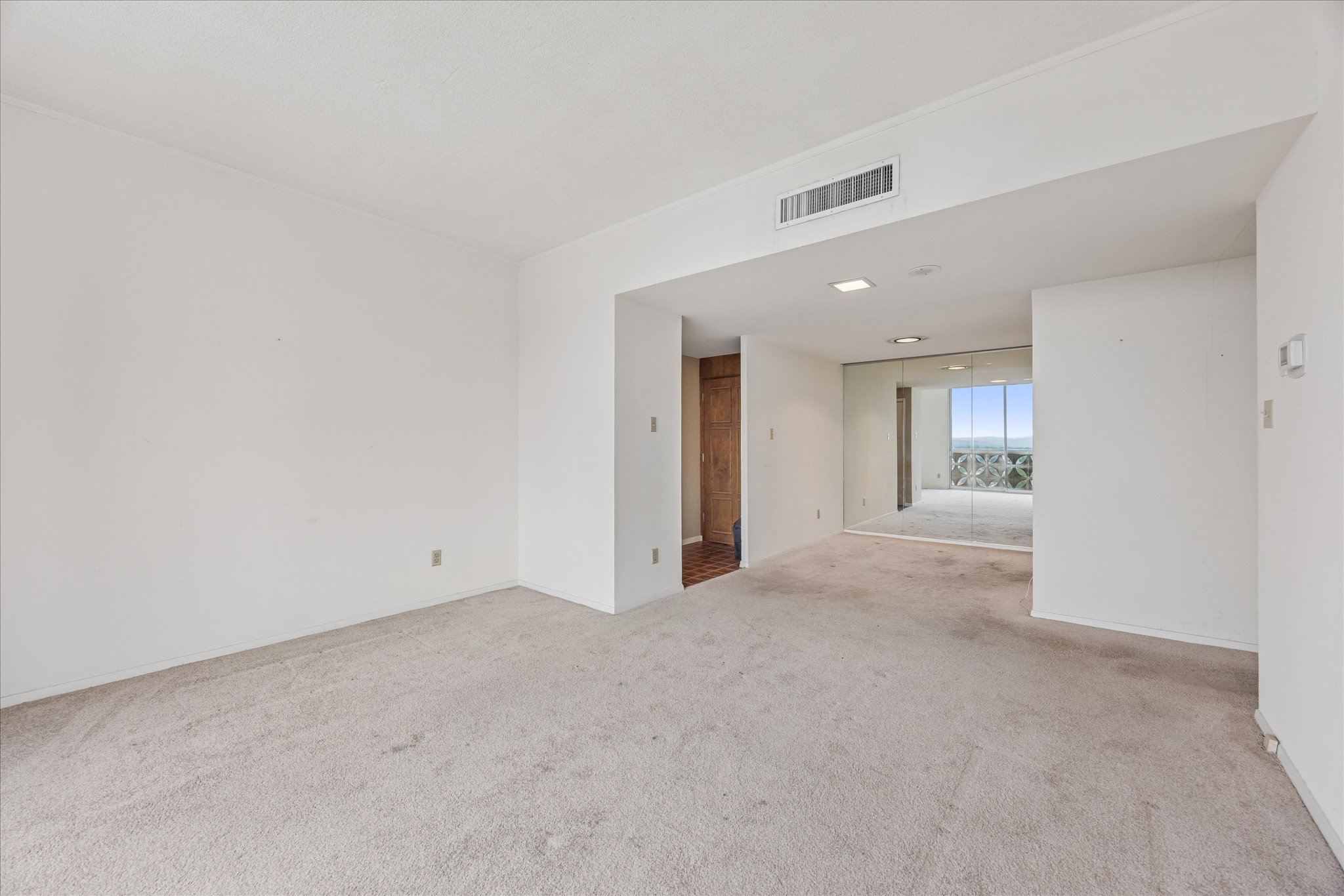 1801 Lavaca Street, Unit 14K Austin, TX 78701 - Photo 8 of 30 a view of an empty room and a window