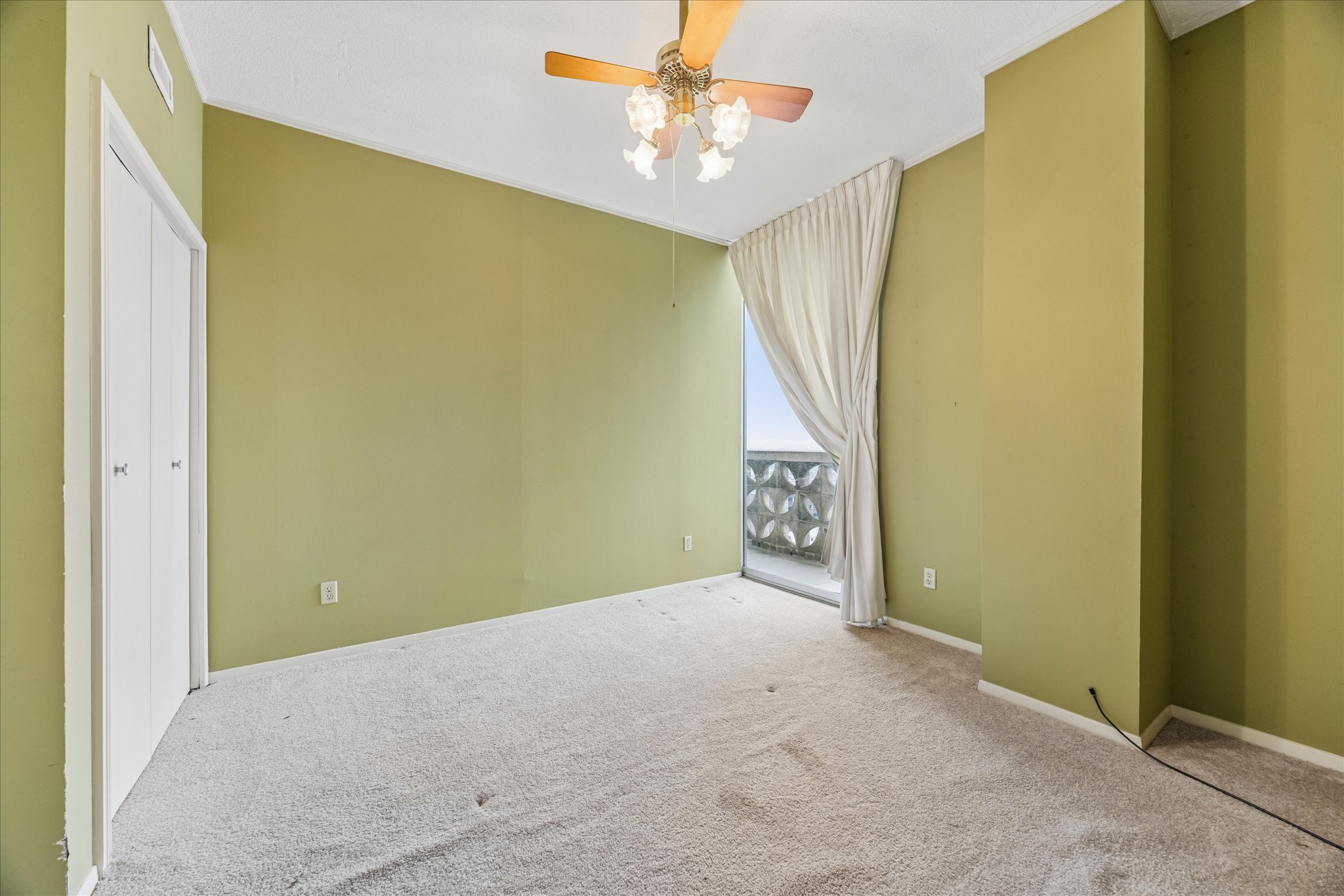 1801 Lavaca Street, Unit 14K Austin, TX 78701 - Photo 10 of 30 an empty room with windows and fan