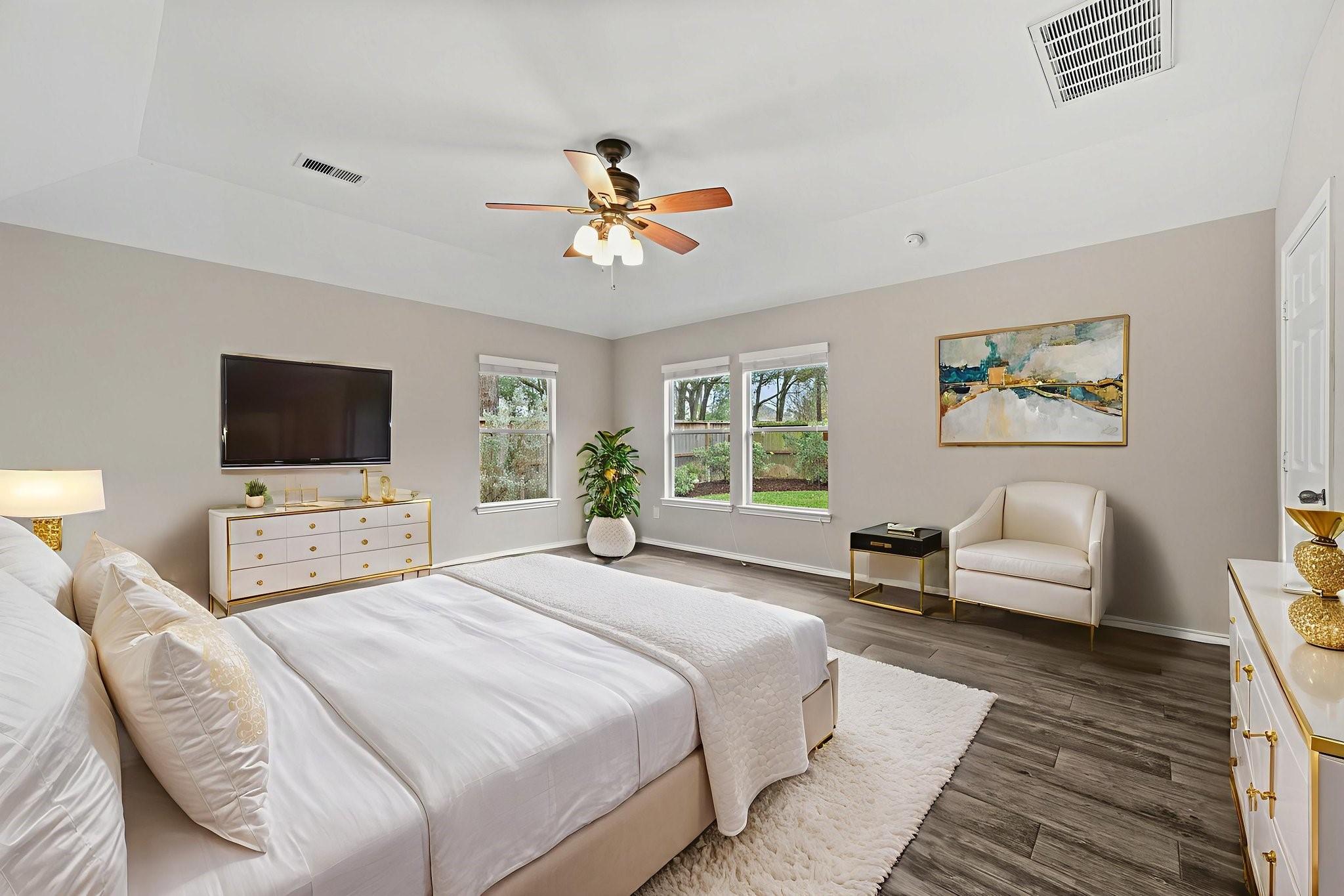 1910 Katlyn Lane Spring, TX 77386 - Photo 18 of 35 This virtually staged bedroom exudes modern elegance with abundant natural light from large windows, offering a serene and inviting retreat.