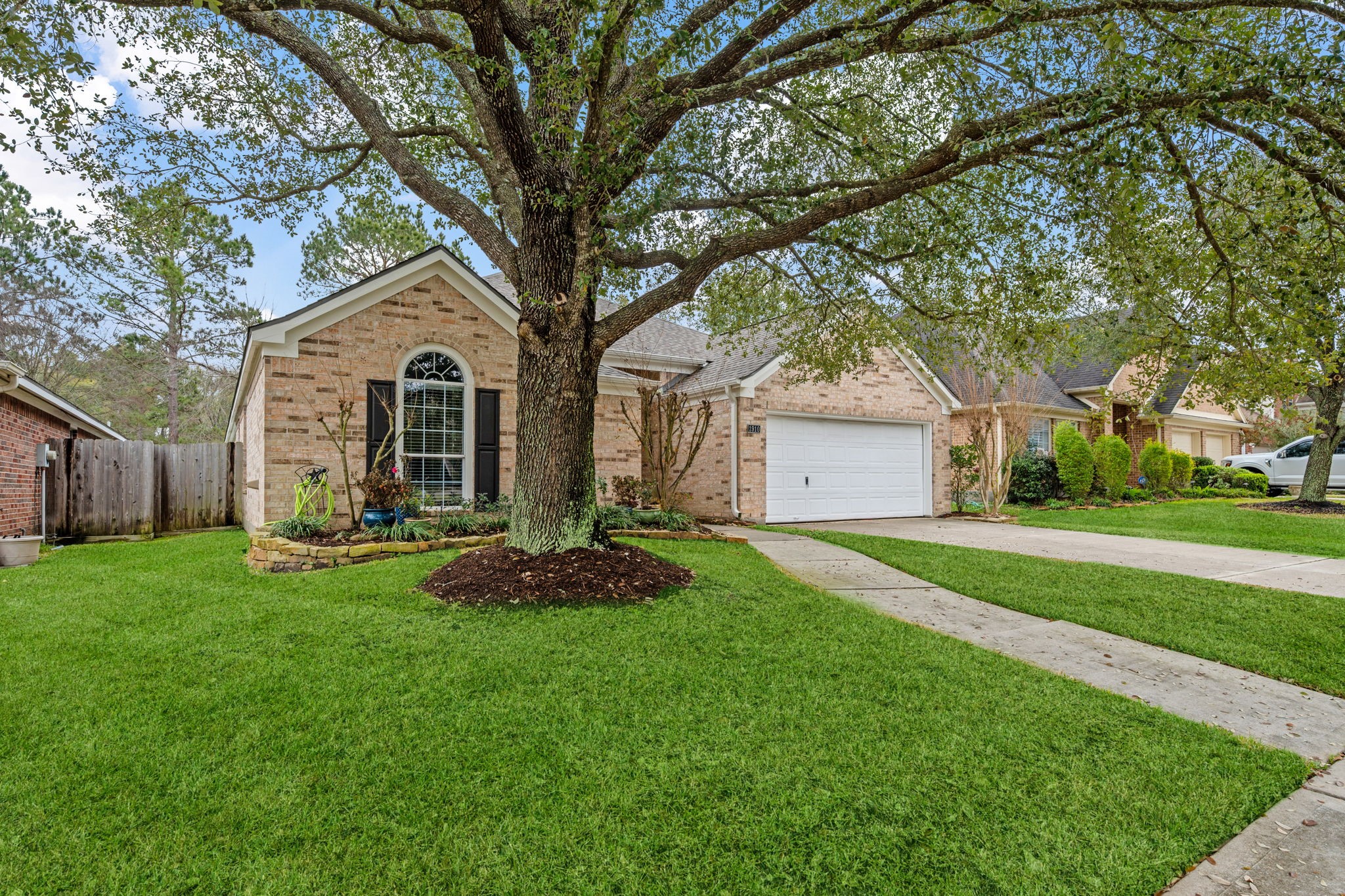 1910 Katlyn Lane Spring, TX 77386 - Photo 2 of 35 Charming single-story brick home with a well-maintained front yard.