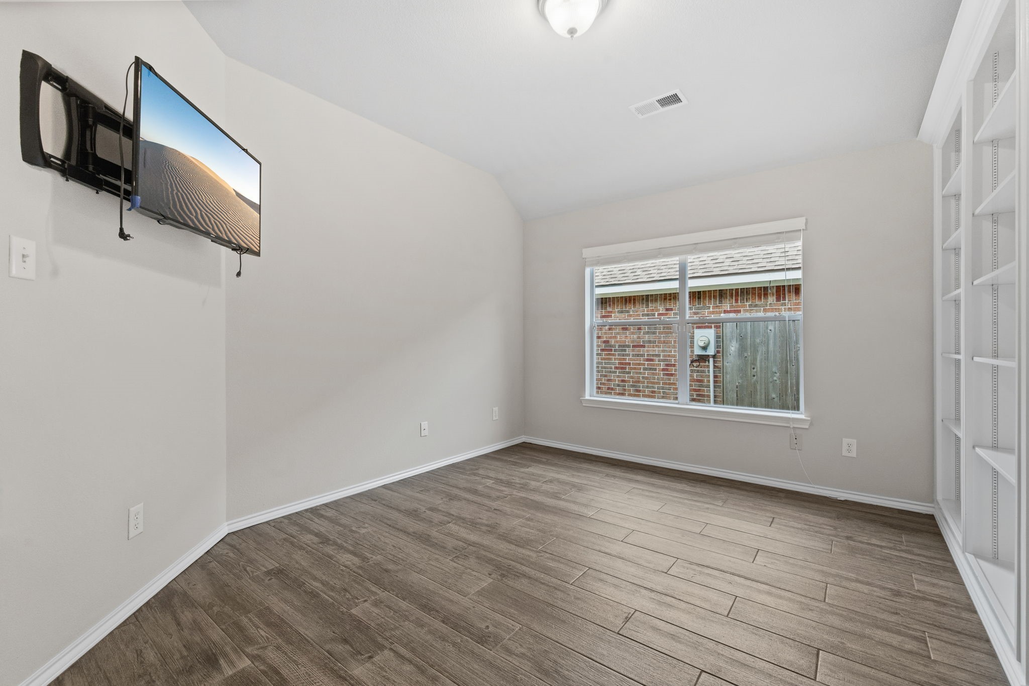 1910 Katlyn Lane Spring, TX 77386 - Photo 30 of 35 Study with French doors leading in and built ins for plenty of book and display space.