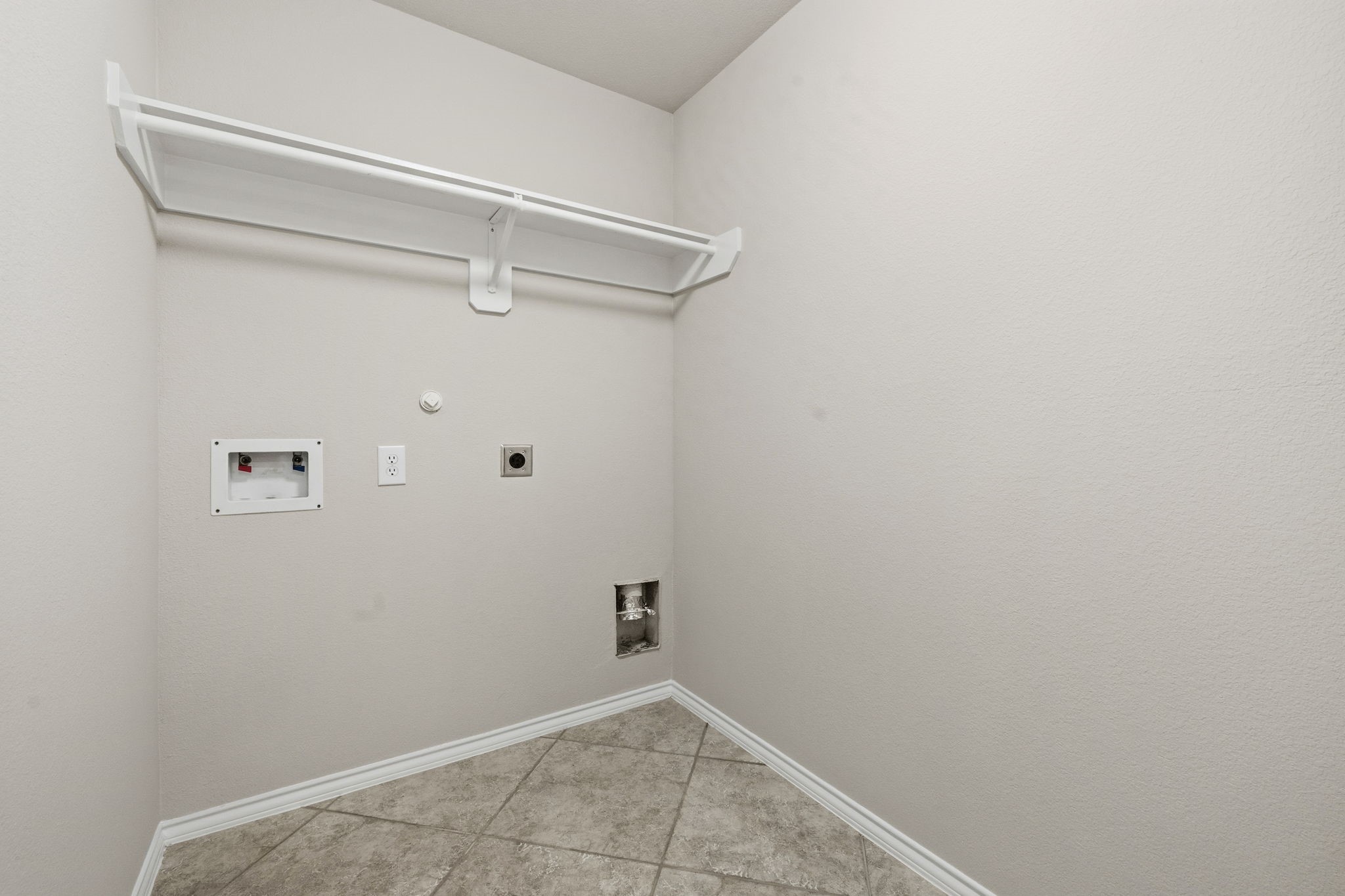 1910 Katlyn Lane Spring, TX 77386 - Photo 31 of 35 Great Laundry room with ample space for getting the chores done.