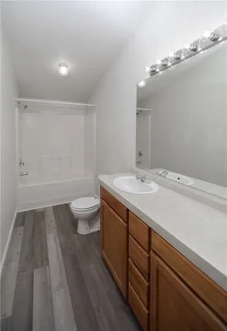 a bathroom with a sink a toilet and view