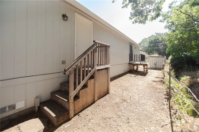 a view of entryway with wooden floor and stairs