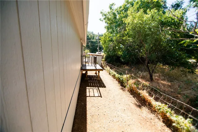 a view of balcony with wooden floor