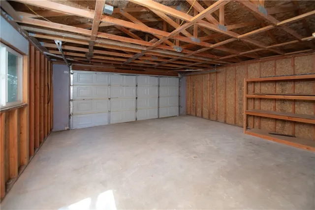 a view of an empty room with a cabinet