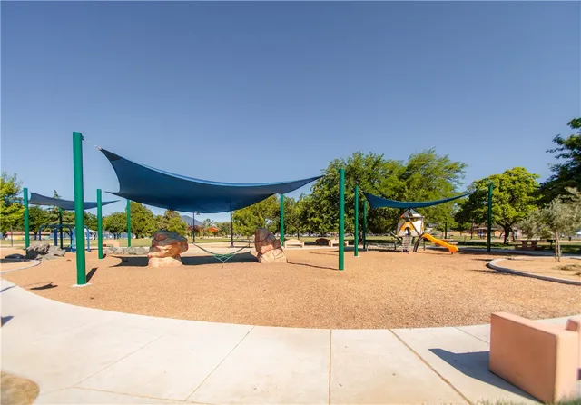 a swimming pool view with a outdoor seating