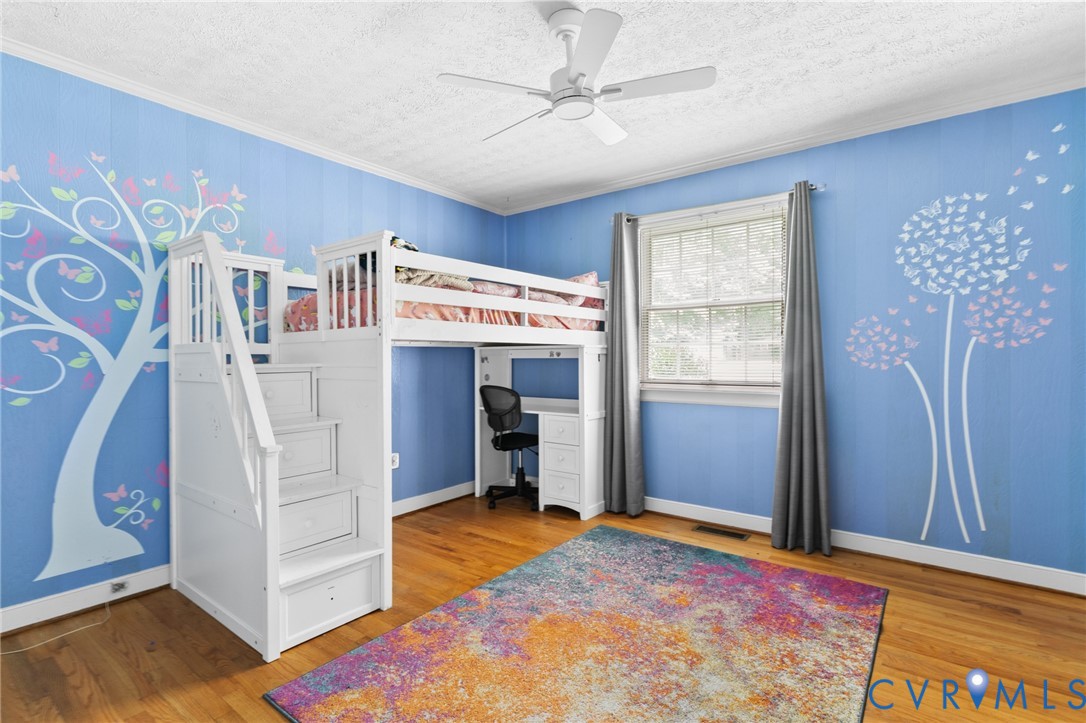 9400 Morley Road Midlothian, VA 23112 - Photo 20 of 38 Bedroom 2 with hardwood floors, crown moulding, an