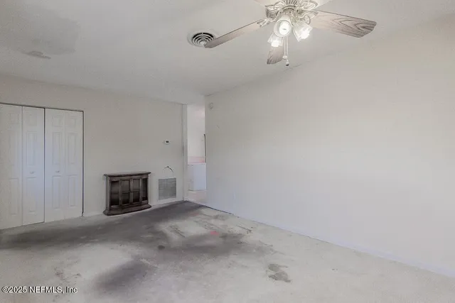 a view of an empty room and window