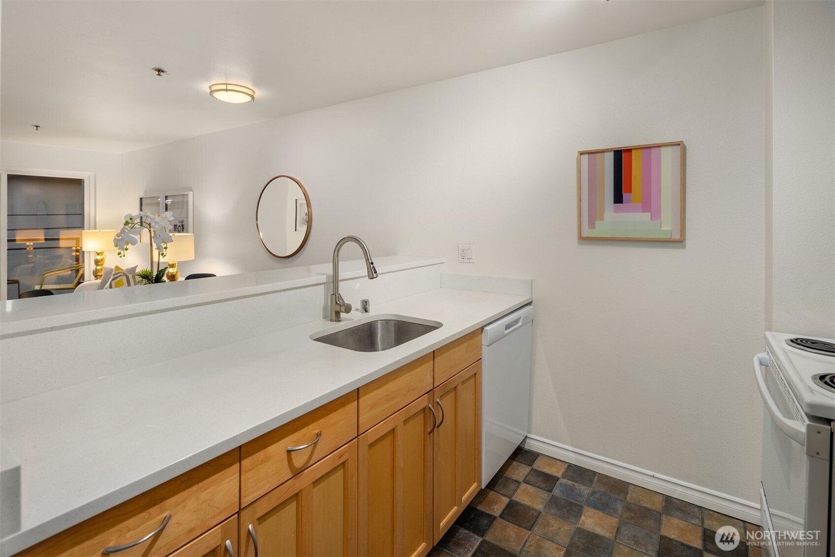 1616 Summit Avenue, Unit N203 Seattle, WA 98122 - Photo 7 of 18 a kitchen with a sink and a refrigerator
