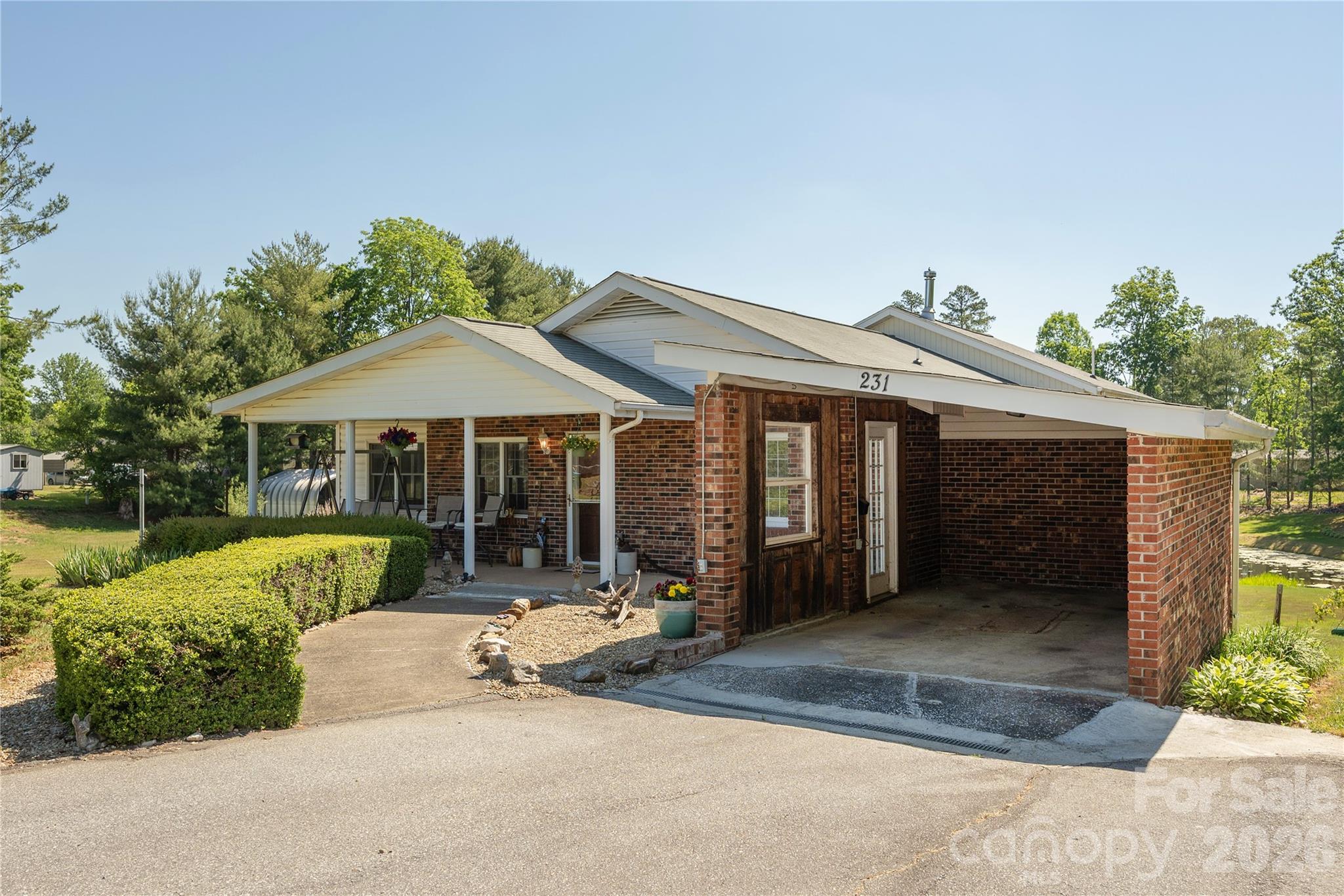 231 Allen Road East Flat Rock, NC 28726 - Photo 3 of 42 front view of a house with a patio