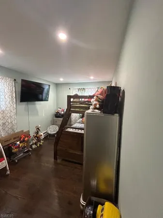 a room with gym equipment and a flat screen tv