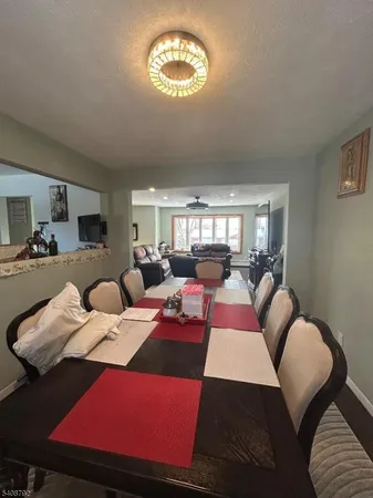a living room with furniture and a lamp