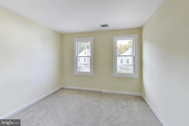 an empty room with windows