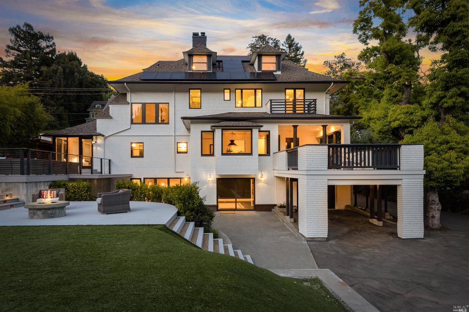 a front view of a house with a yard table and chairs