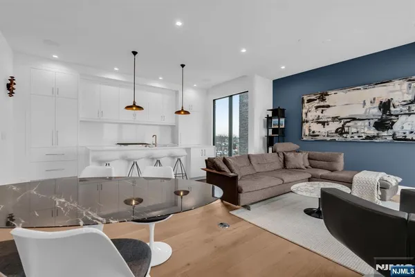 a large living room with furniture and a large window