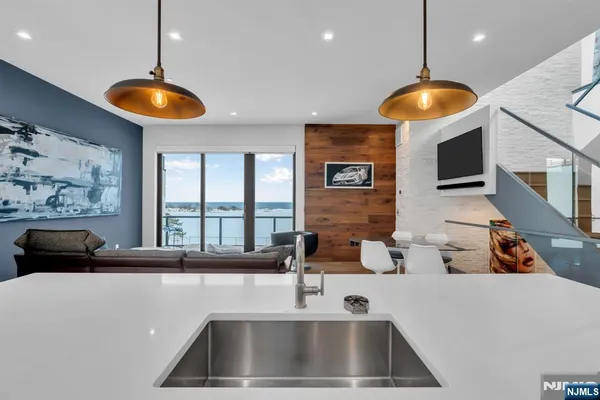 a kitchen with a sink and a refrigerator