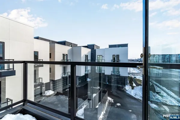 a view of a balcony with wooden floor