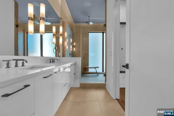 a bathroom with a bathtub and a shower