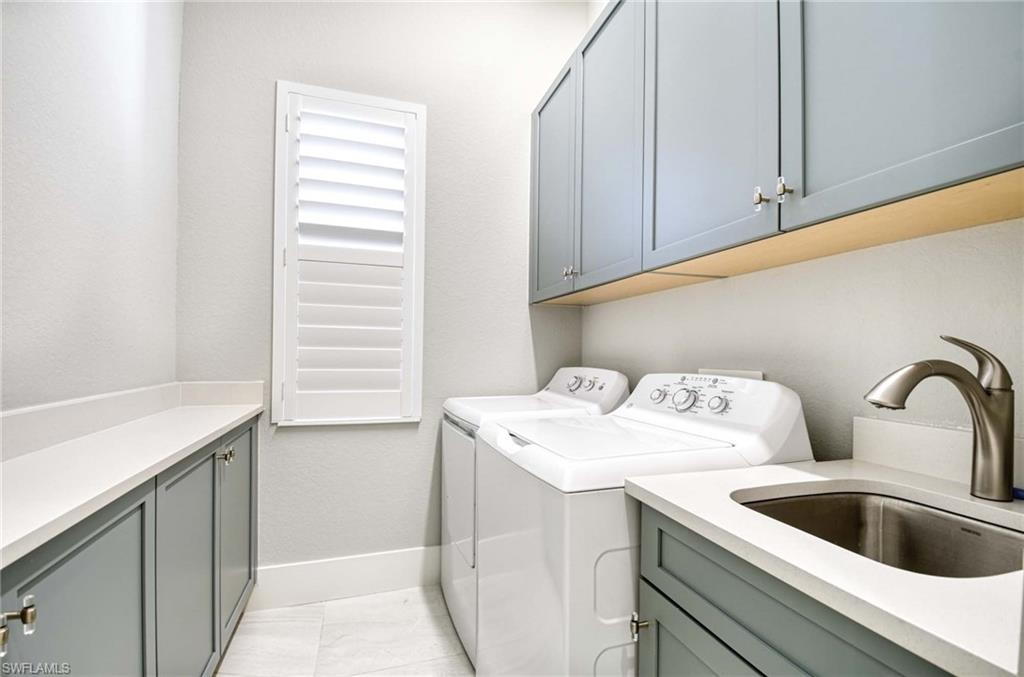 7516 Treeline Drive Naples, FL 34119 - Photo 19 of 33 a utility room with dryer and washer