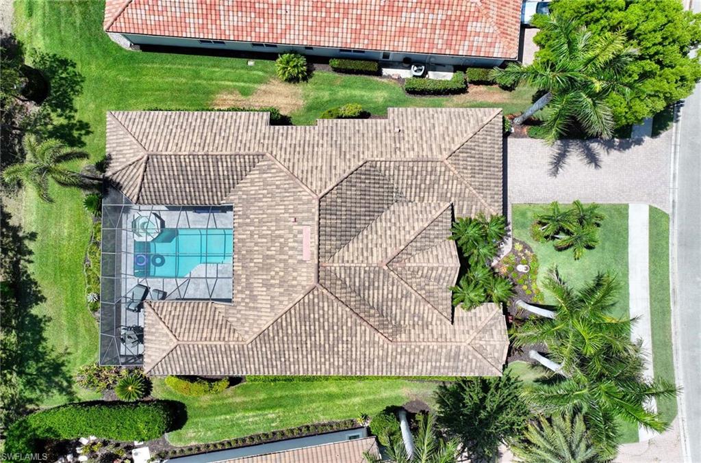 7516 Treeline Drive Naples, FL 34119 - Photo 2 of 33 an aerial view of a house with a garden and plants