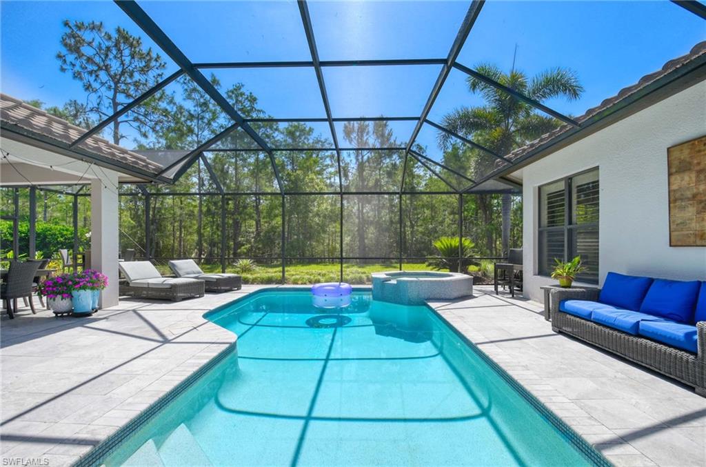 7516 Treeline Drive Naples, FL 34119 - Photo 22 of 33 a view of swimming pool with seating area and furniture