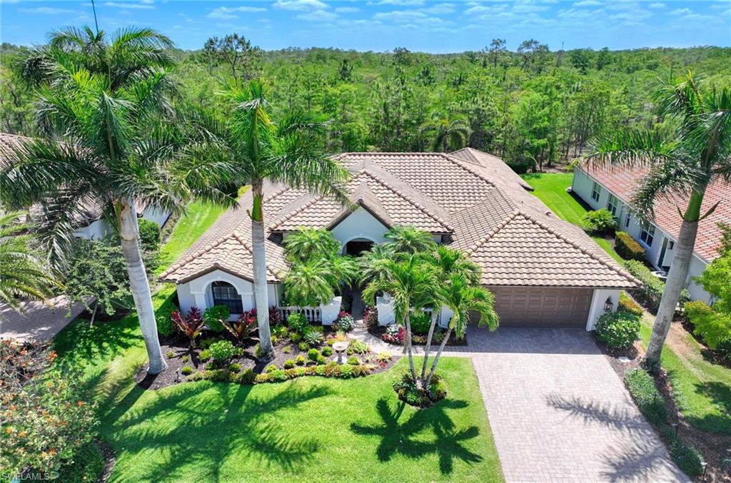7516 Treeline Drive Naples, FL 34119 - Photo 24 of 33 a aerial view of a house with swimming pool garden and patio