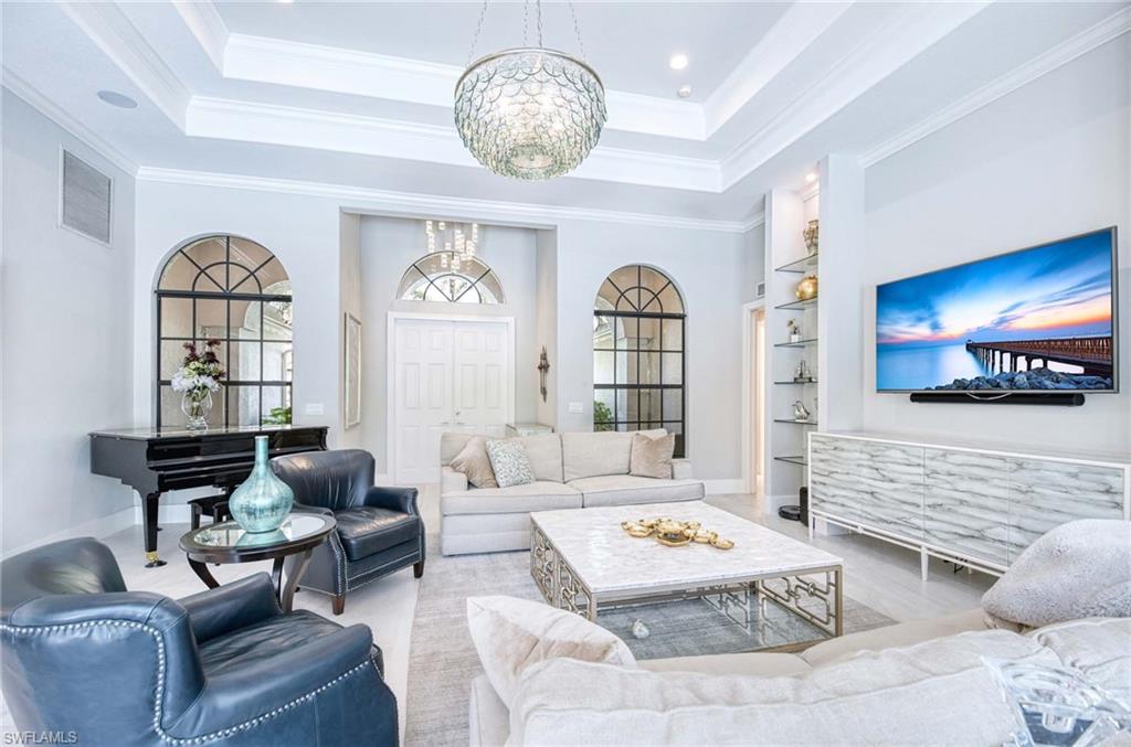 7516 Treeline Drive Naples, FL 34119 - Photo 6 of 33 a living room with furniture and a large window