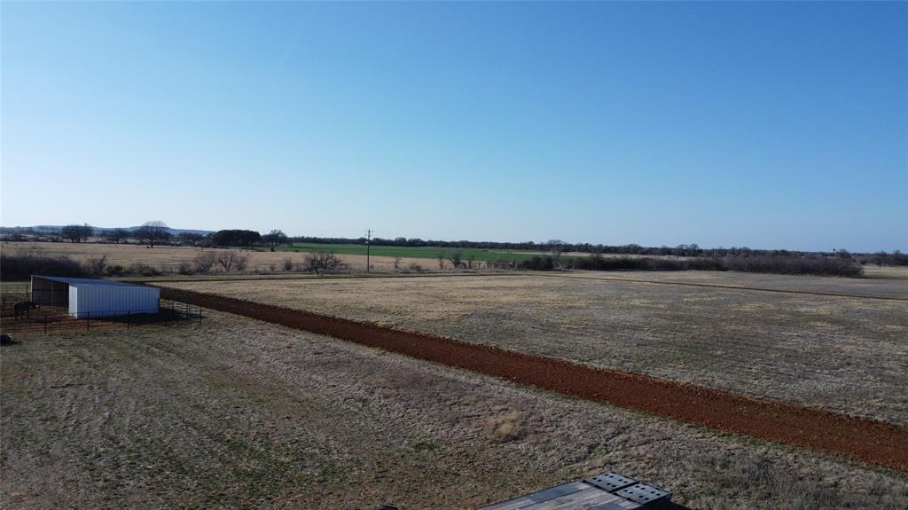 1595 Cr 131 Rising Star Tx 76471 Rising Star, TX 76471 - Photo 15 of 20 a view of a lake with houses in background